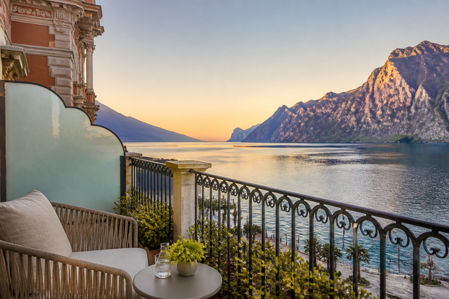 Luxury hotel balcony in Riva del Garda overlooking the lake and mountains at dawn | נוף בוקר מהמרפסת בריבה דל גארדה.